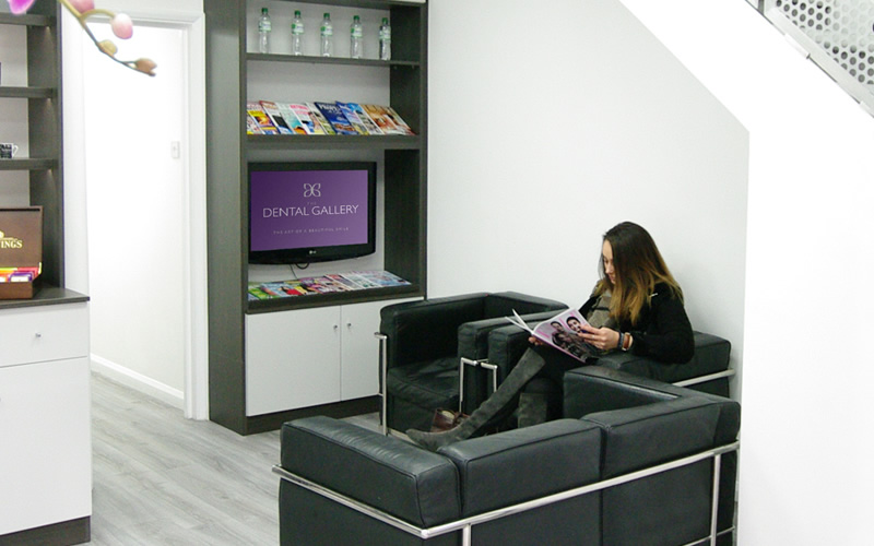 A patient waiting in reception at the Dental Gallery Ealing