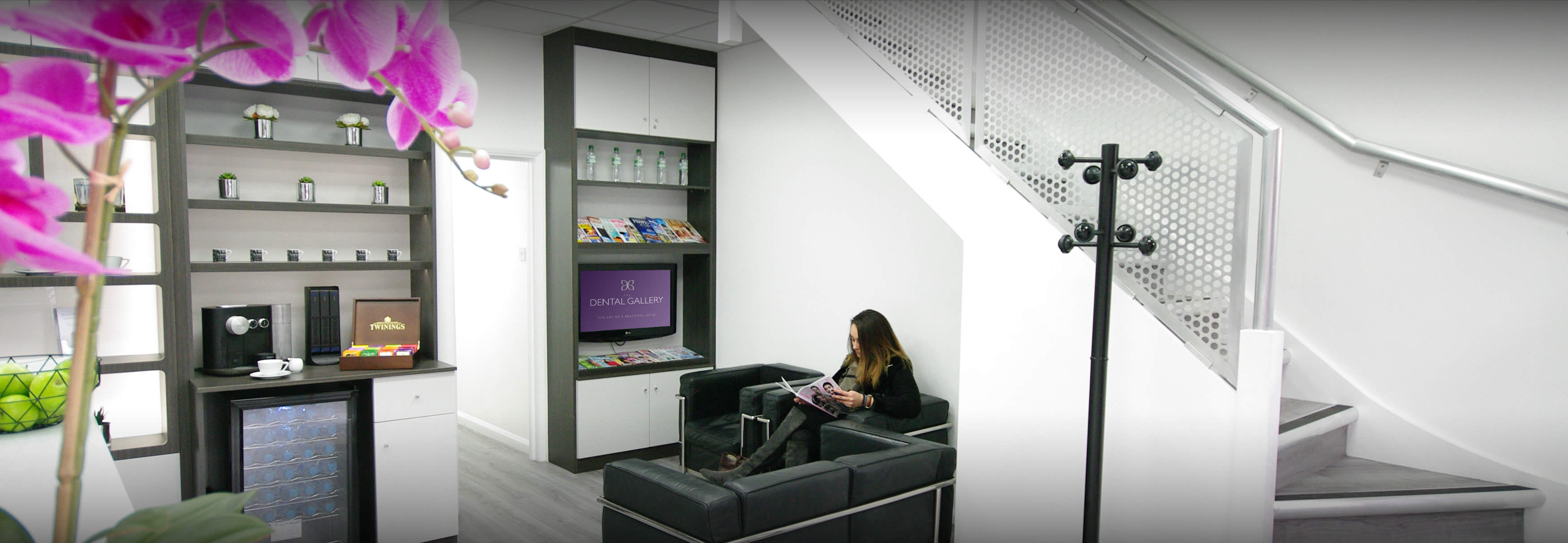 A patient waiting in reception at the Dental Gallery Ealing